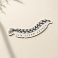 Die-cut vinyl sticker of a woven braid with the words Jin Jiyan Azadî