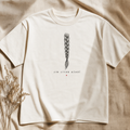 Bone heavyweight tee with a single braid line-art and the words Jin Jiyan Azadî